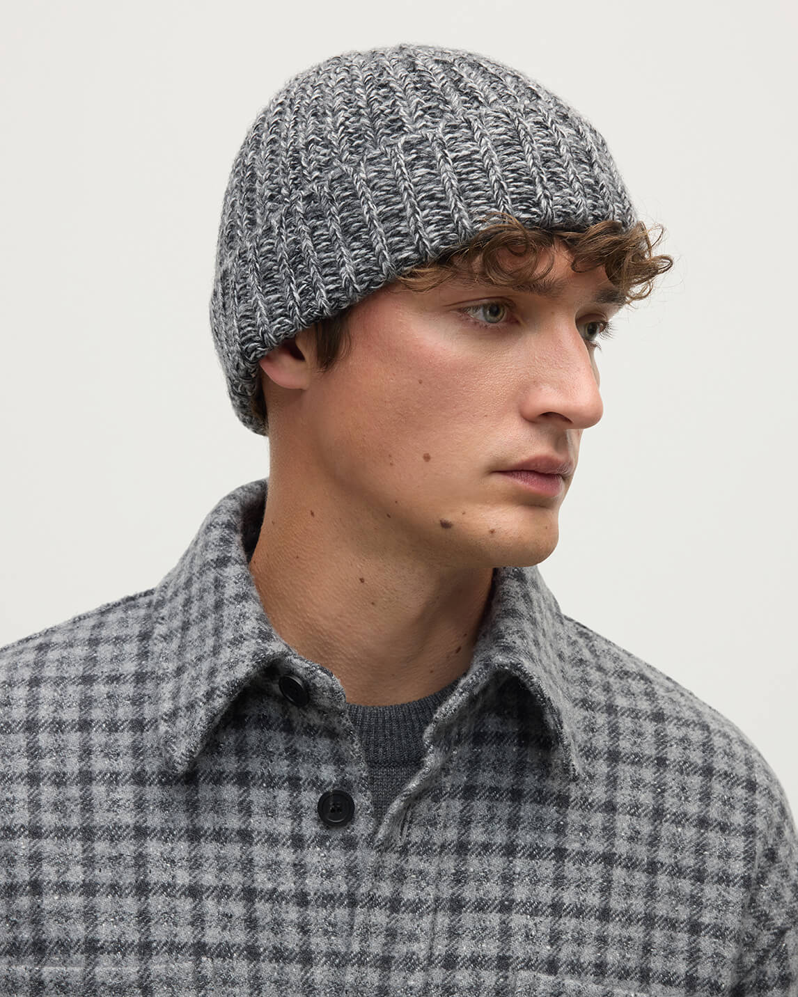 model wears Johnstons of Elgin AW25 Knitted Accessories Charcoal Marl Half Cardigan Stich Grey Cashmere Beanie HAT02850006354ONE
