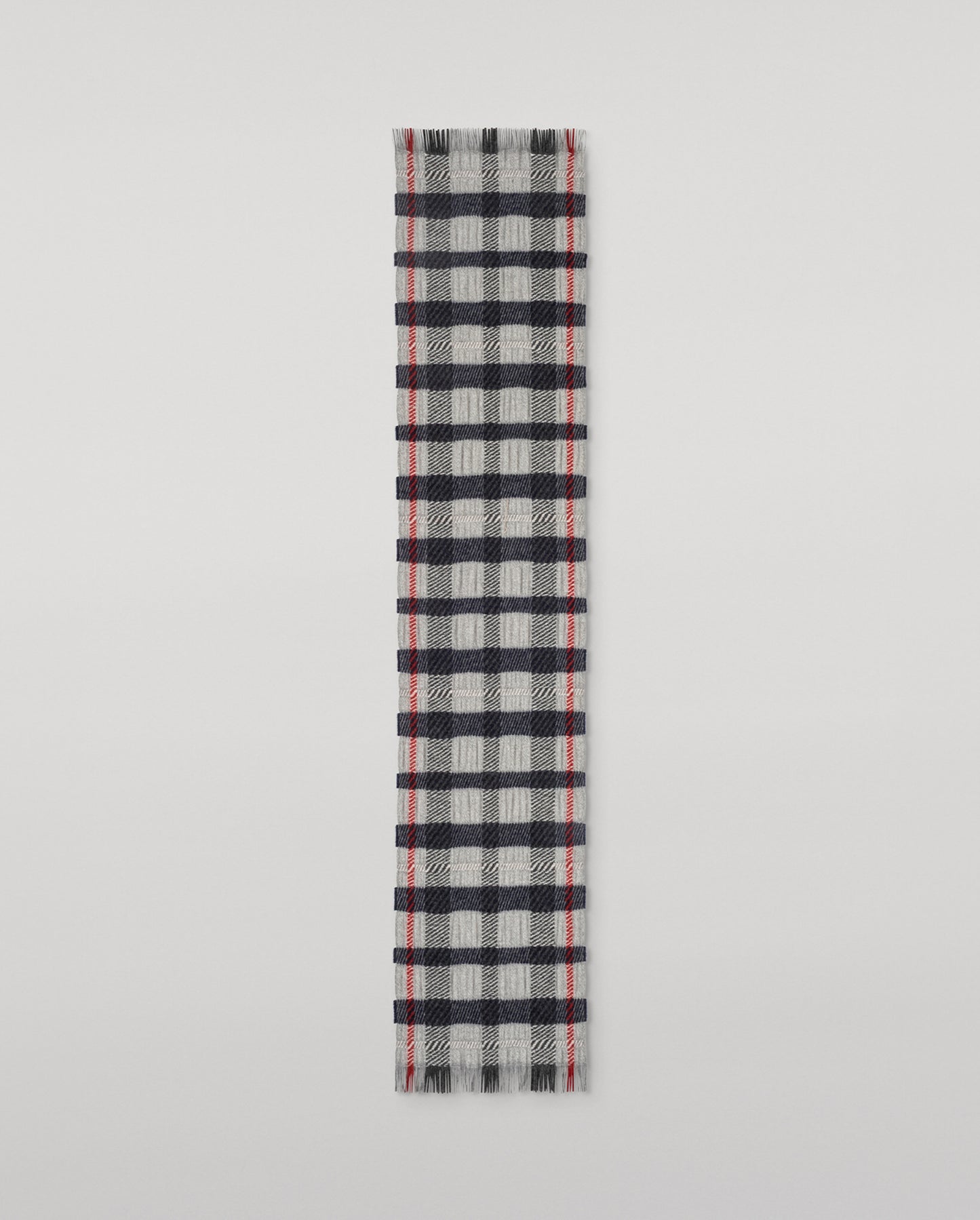 Johnstons of Elgin Plaid scarf with black, red, and gray pattern on a light gray background WA002615RU7820