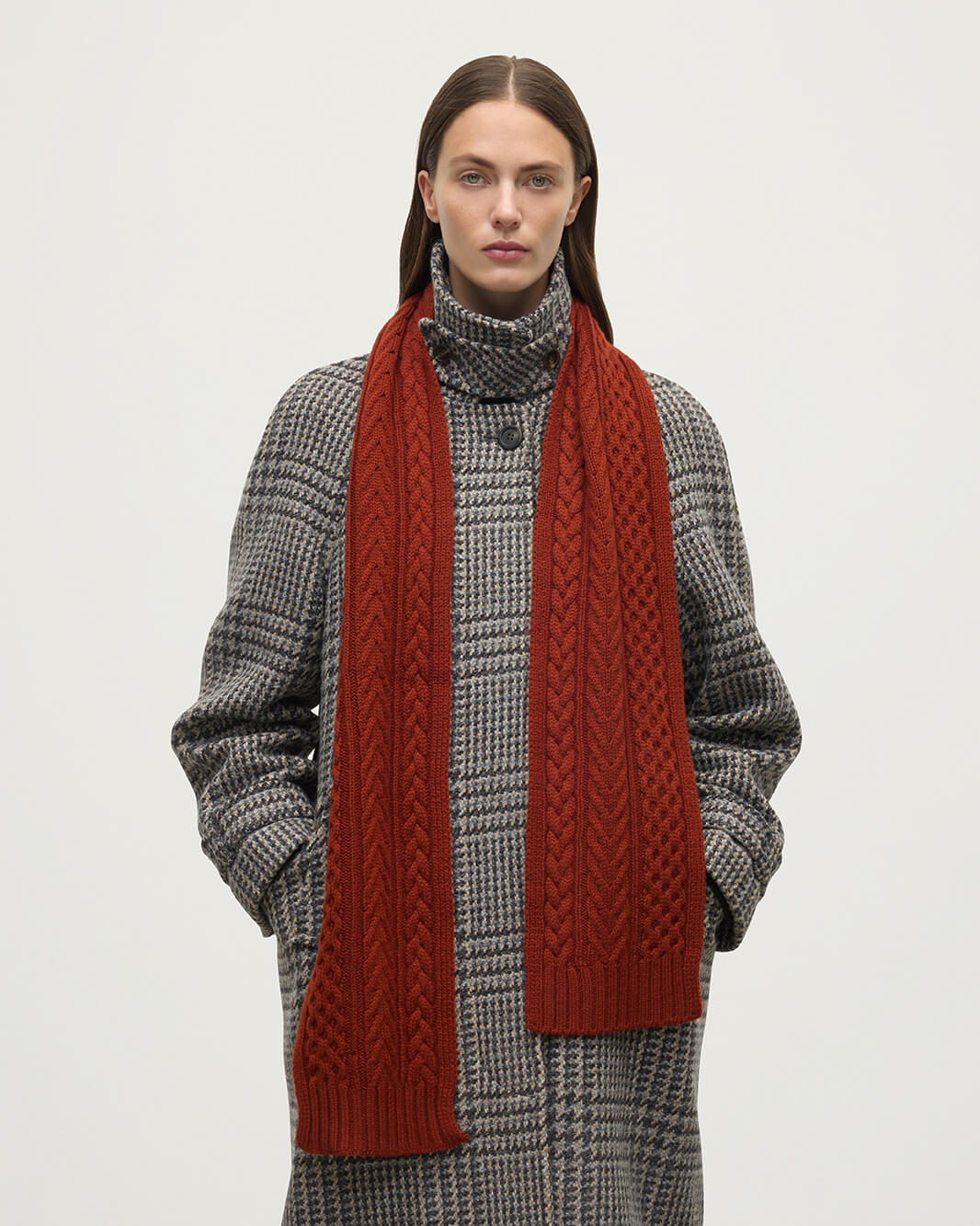 Model wears Johnstons of Elgin Cable cashmere red scarf HAC03406SG4463ONE