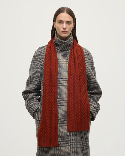 Model wears Johnstons of Elgin Cable cashmere red scarf HAC03406SG4463ONE