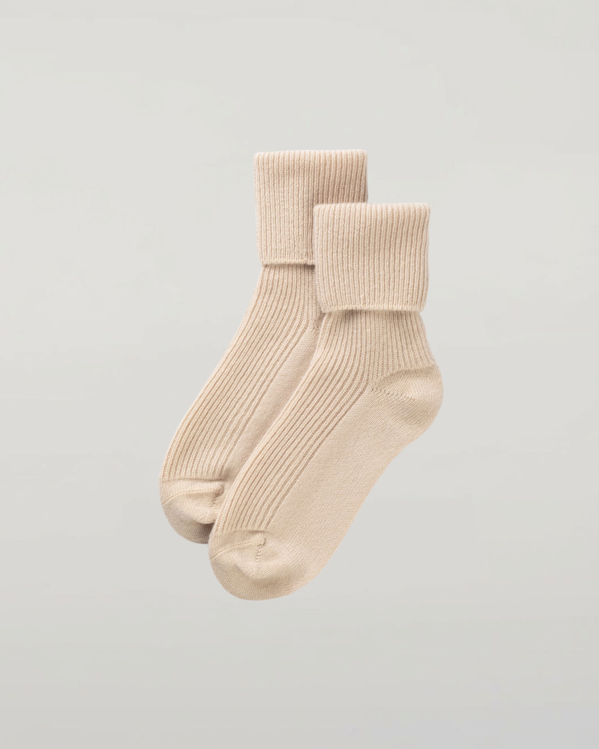Johnstons of Elgin set of three pairs of cashmere socks in pastel colours on a light grey background 2025GIFTSET3A