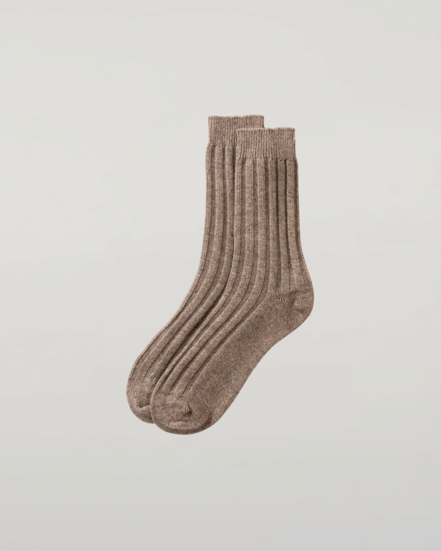 Johnstons of Elgin set of three pairs of cashmere socks in grey, beige, and green on a light grey background 2025GIFTSET4B
