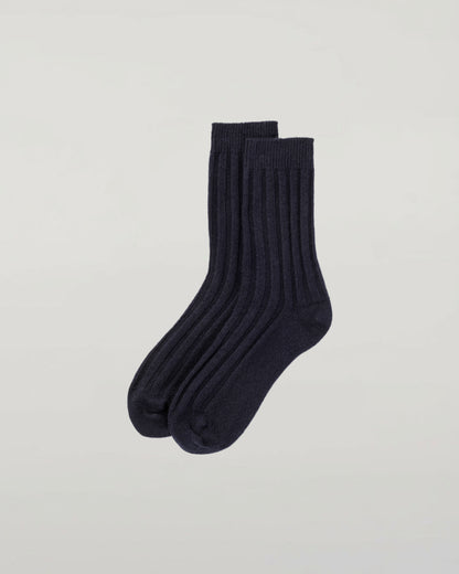 Johnstons of Elgin set of three pairs of cashmere socks in navy, light grey, and mid grey on a light grey background 2025GIFTSET4A