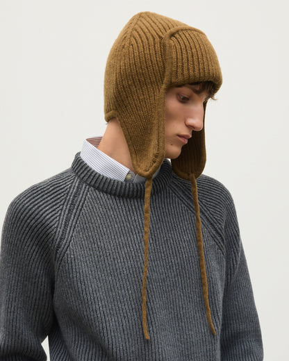 MALE MODEL WEARING JOHNSTONS OF ELGIN CASHMERE RIBBED DEER STALKER BEANIE GREEN 100% CASHMERE WITH PIONEER SWEATER IN GREY CRANE  HAT03646Q26299ONE