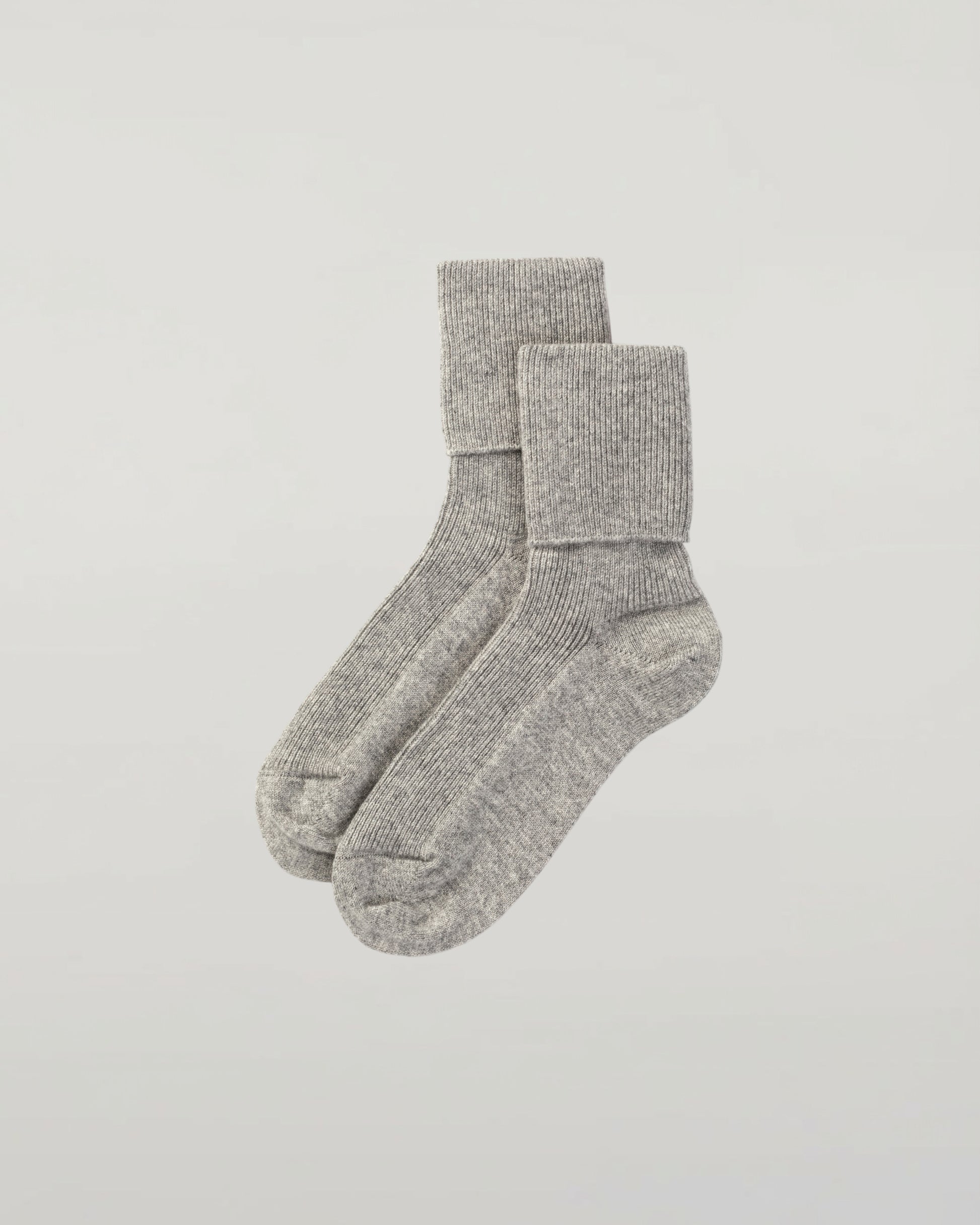 Johnstons of Elgin set of three pairs of cashmere socks in light blue, white, and navy on a white background 2025GIFTSET3B