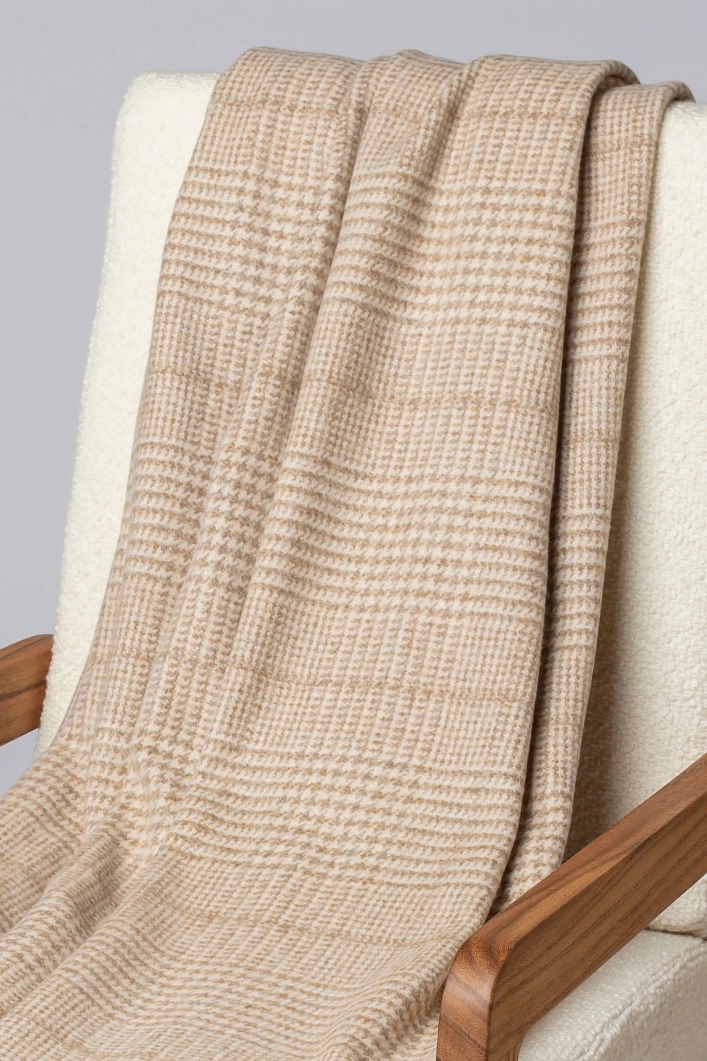 2025 Johnstons of Elgin Interiors Collection Natural Tweed Glen Check Wool Throw on a grey background  WDC01930RU7651ONE