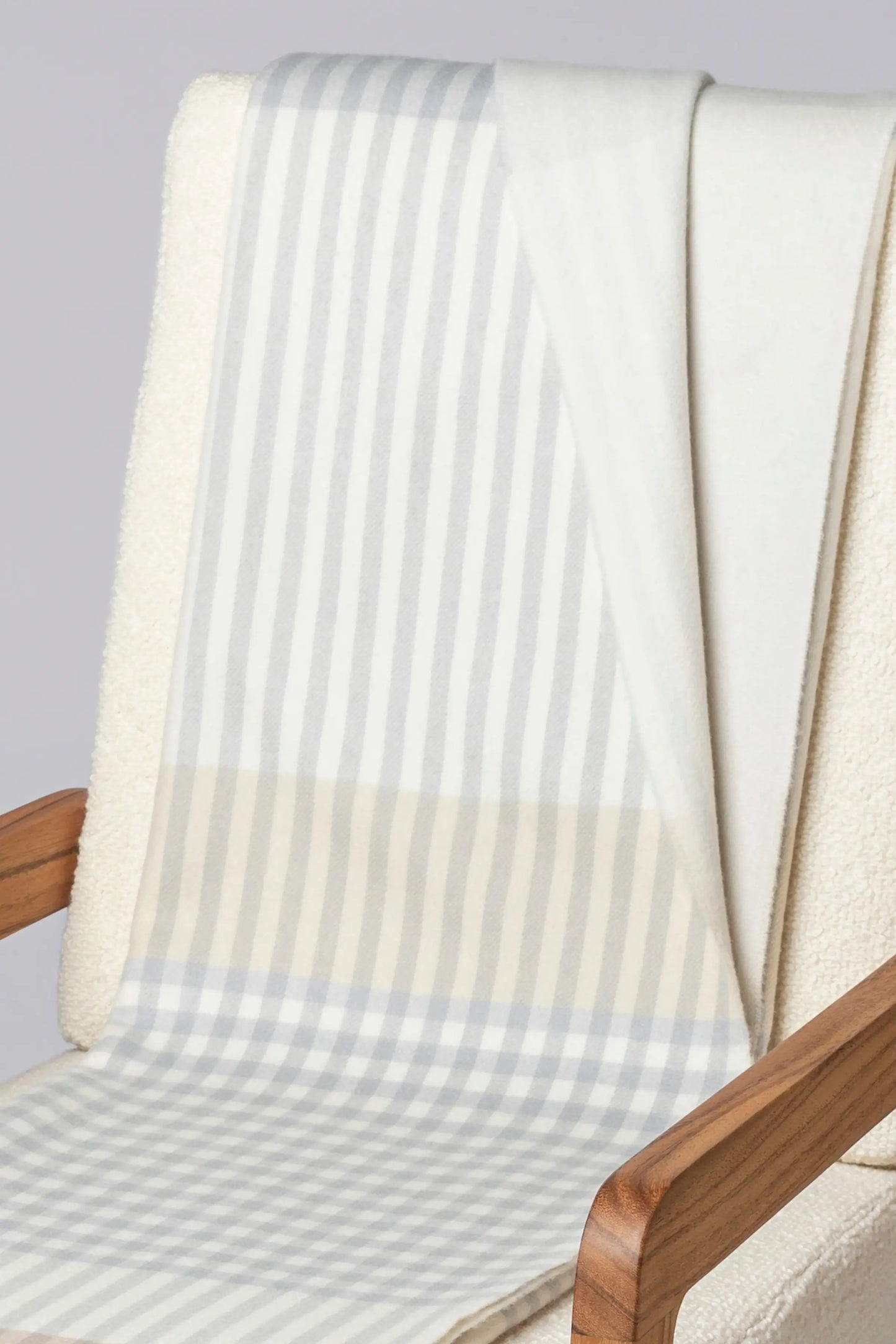 2025 Johnstons of Elgin Interiors Collection Heron Check Reversible Cashmere Throw on a grey background  WA000013RU7604ONE