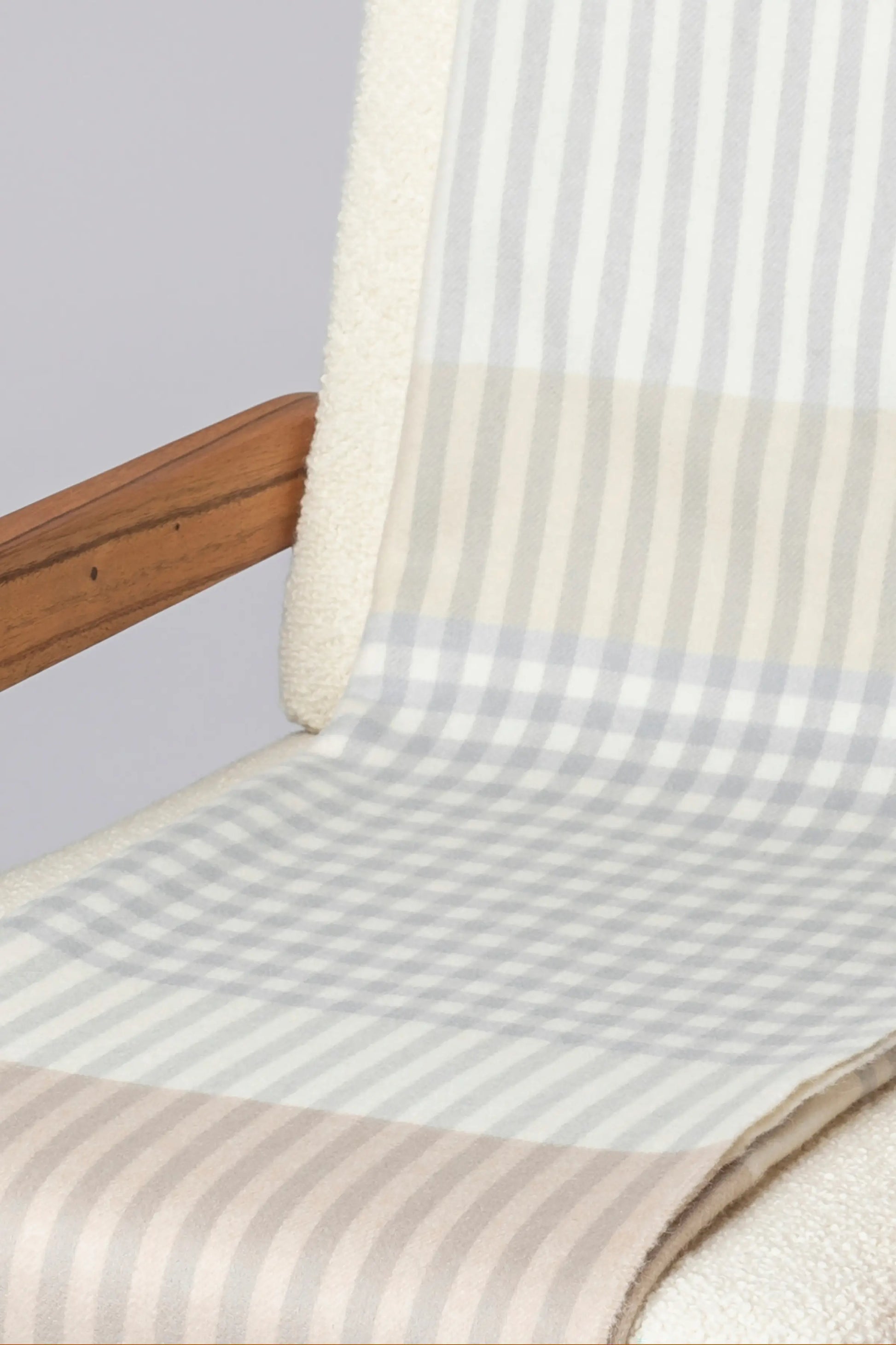 2025 Johnstons of Elgin Interiors Collection Heron Check Reversible Cashmere Throw on a grey background  WA000013RU7604ONE