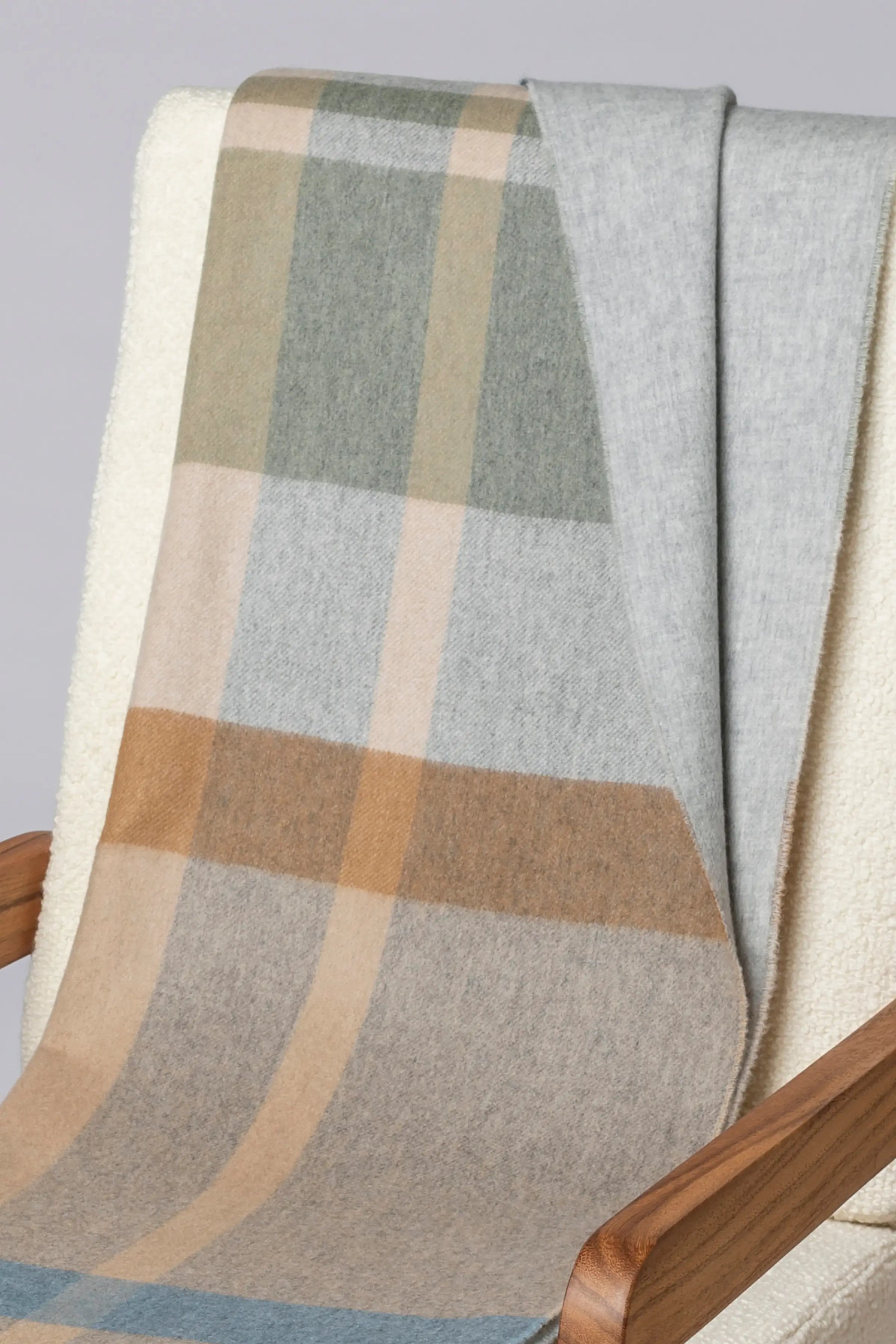 2025 Johnstons of Elgin Interiors Collection Birch Check Reversible Cashmere Throw on a grey background  WA000013RU7603ONE