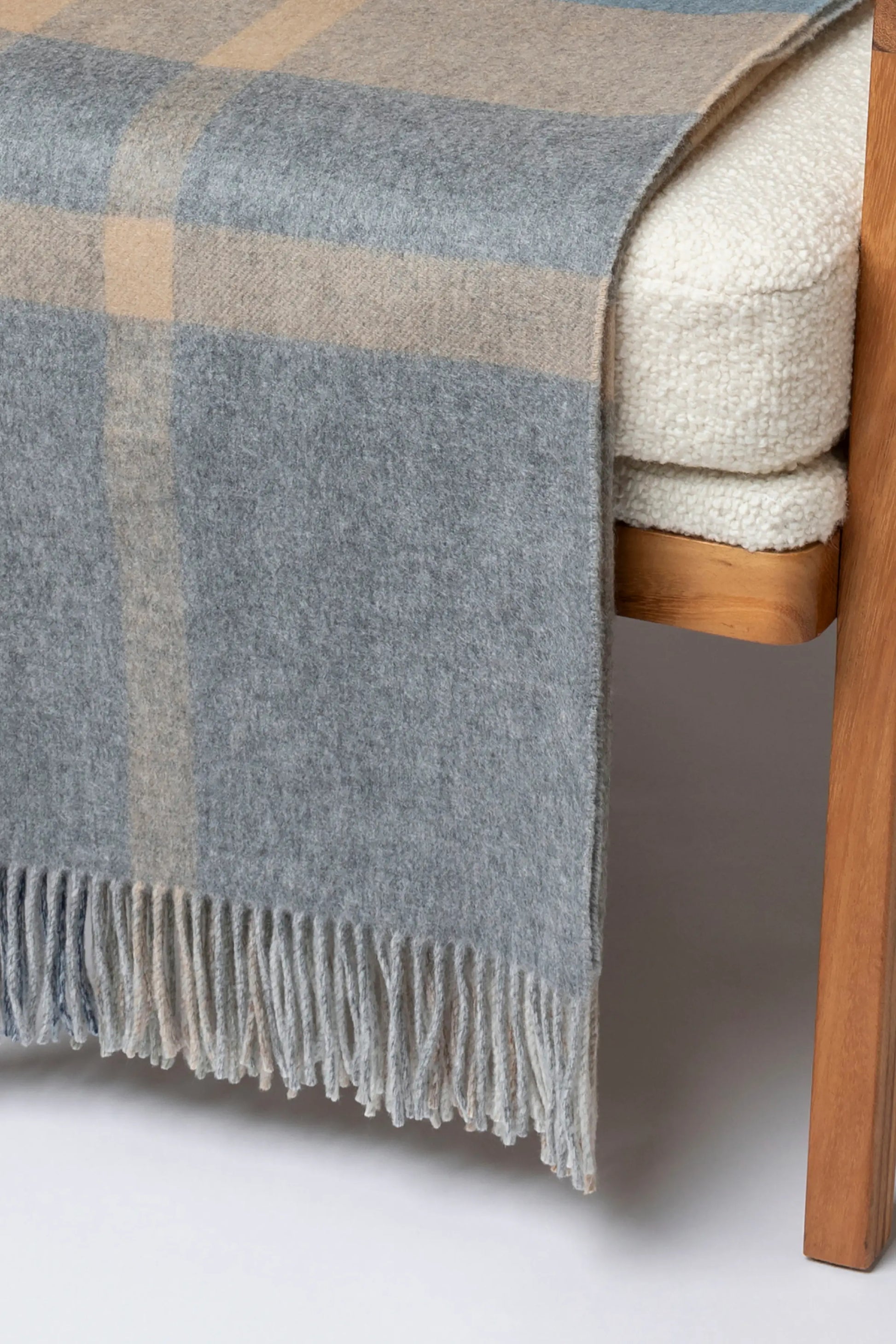 2025 Johnstons of Elgin Interiors Collection Birch Check Reversible Cashmere Throw on a grey background  WA000013RU7603ONE