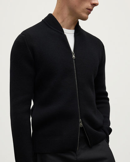 Close up of a model wearing Johnstons of Elgin Men's Knitwear Black Milano Ribbed Zip Black Cashmere  KAA05443SA7210