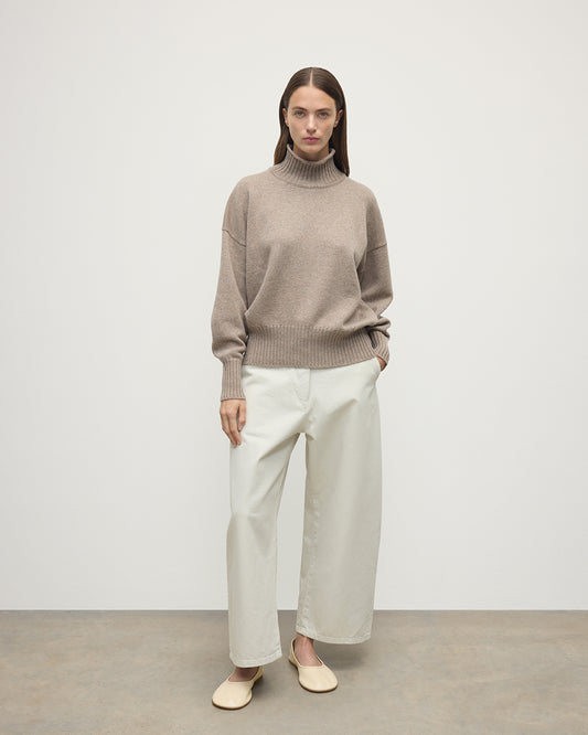 Model wearing Johnstons of Elgin AW25 Women's Knitwear Ash High Neck Brown Cashmere Jumper Front View KAA05585HB4334
