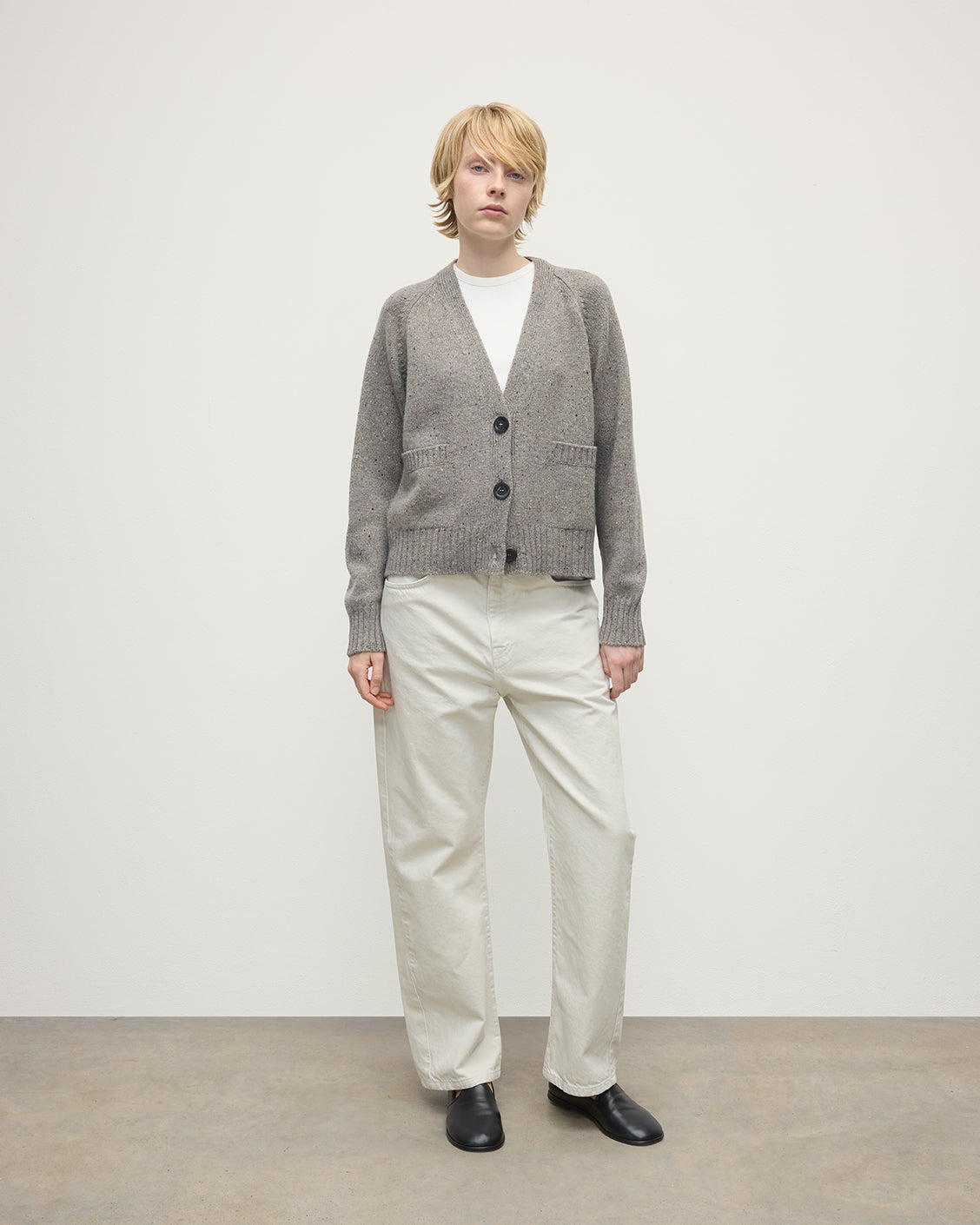 Model wearing Johnstons of Elgin AW25 Women's Knitwear Peregrine Donegal Donegal Cashmere Grey V Neck Cardigan Front View KAC05090006335