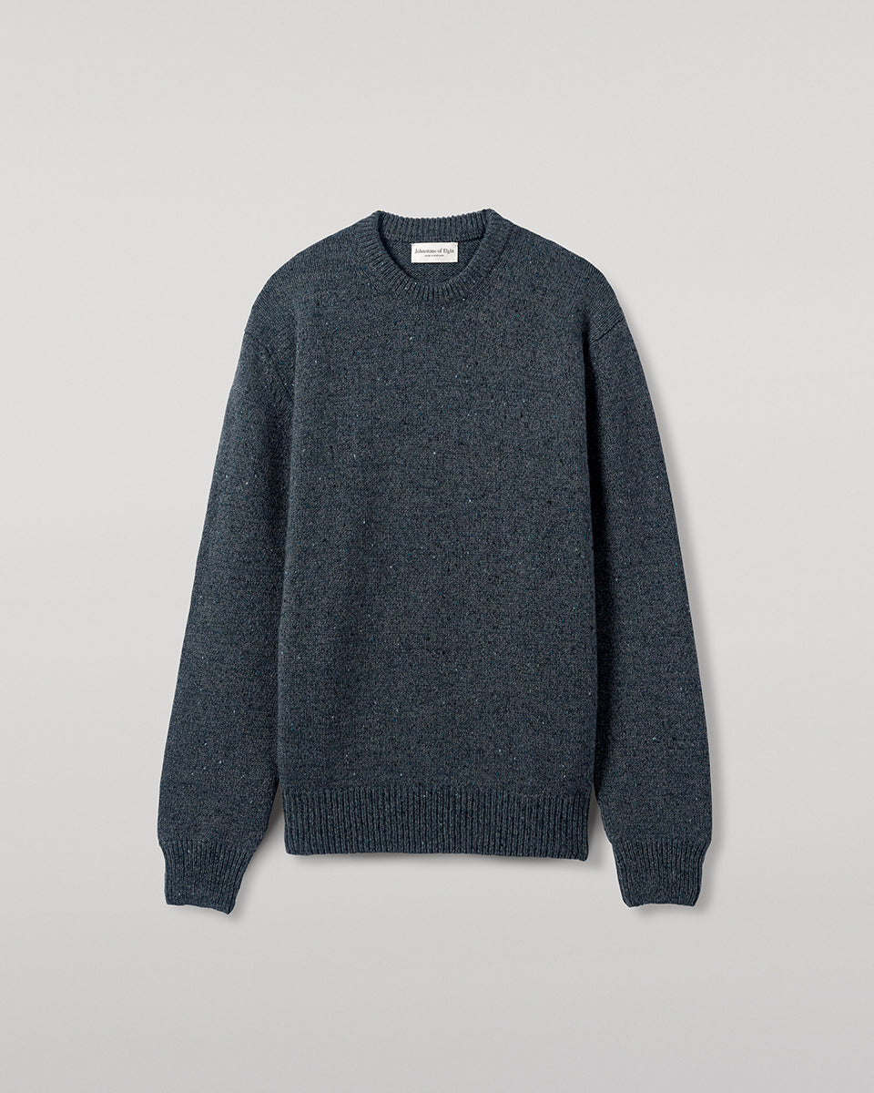 Close up view of a model wearing Johnstons of Elgin AW25 Men's Knitwear Storm Donegal Donegal Cashmere Marl Jumper KAC05287006336