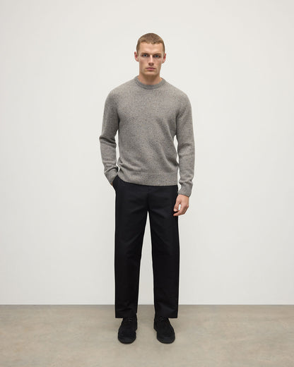 Model wearing Johnstons of Elgin AW25 Men's Knitwear Peregrine Donegal Grey Donegal Cashmere Marl Jumper Front  KAC05287006335