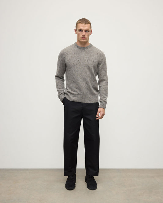 Model wearing Johnstons of Elgin AW25 Men's Knitwear Peregrine Donegal Grey Donegal Cashmere Marl Jumper Front  KAC05287006335