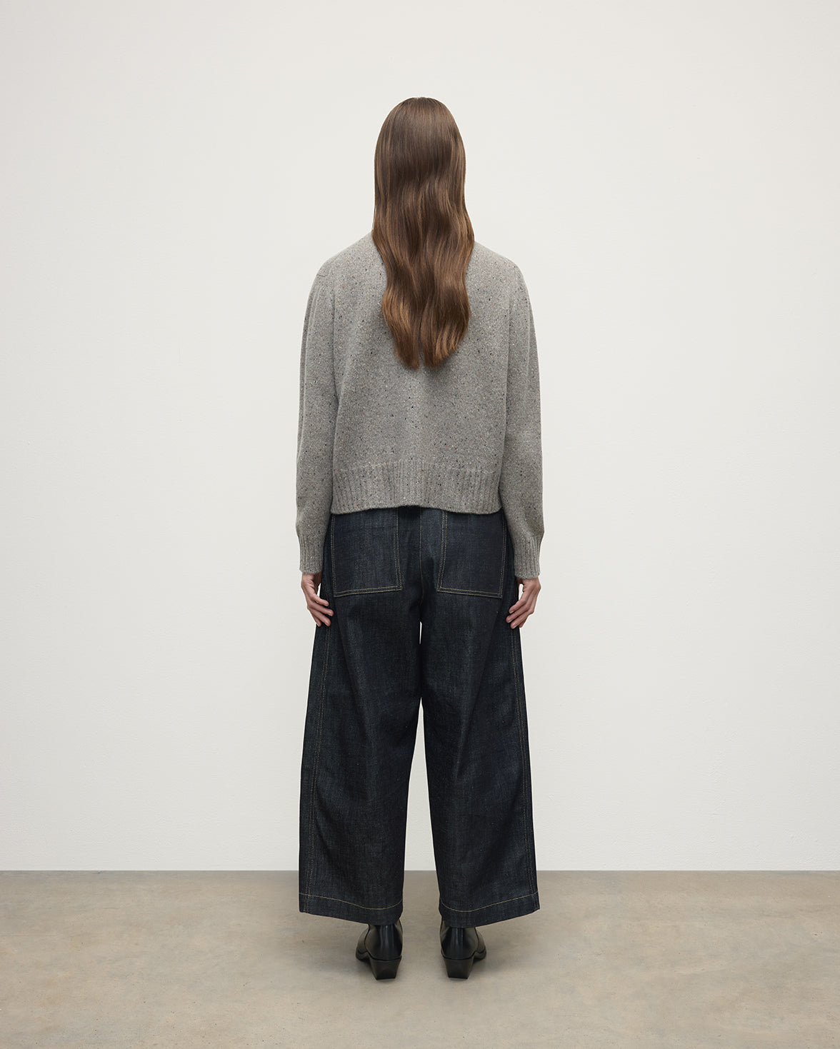 Model wearing Johnstons of Elgin AW25 Women's Knitwear Peregrine Donegal Donegal Cashmere Grey Jumper Back View KAC05289006335