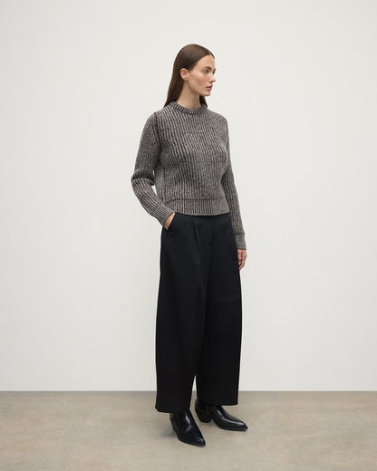 Model wearing Johnstons of Elgin AW25 Women's Knitwear Peregrine Donegal & Molasses High Neck Donegal Cashmere Brown Jumper Side View KAC05590Q25393