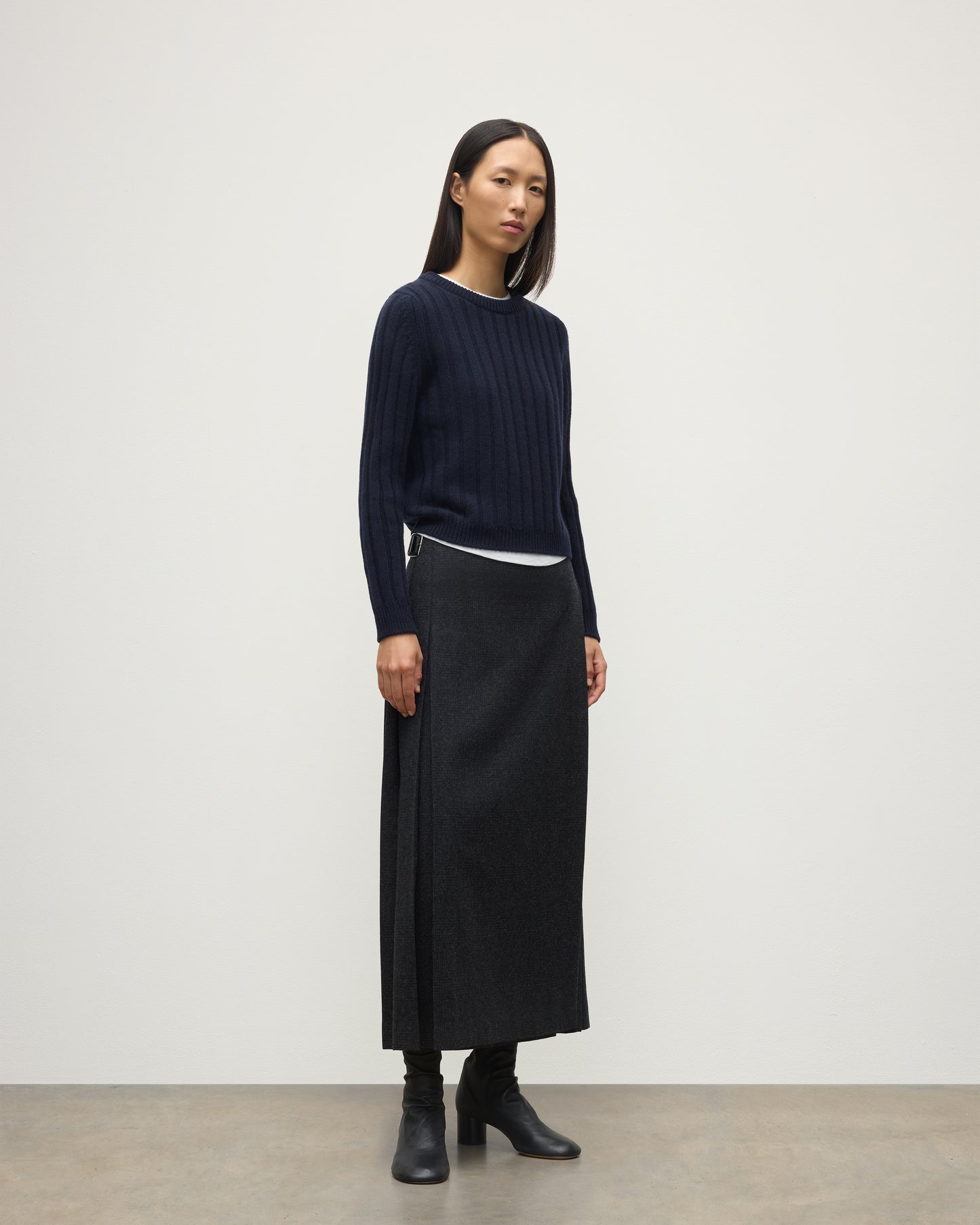 MODEL WEARING JOHNSTONS OF ELGIN WOMENS LECHT CREW SWEATER NAVY WORN WITH LONG LE KILT CHARCOAL KILT 100% CASHMERE KAC05706SD7666