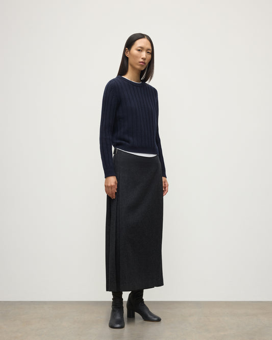 MODEL WEARING JOHNSTONS OF ELGIN WOMENS LECHT CREW SWEATER NAVY WORN WITH LONG LE KILT CHARCOAL KILT 100% CASHMERE KAC05706SD7666