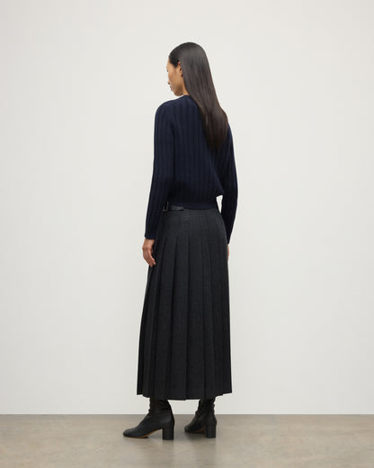 BACK OF MODEL WEARING JOHNSTONS OF ELGIN WOMENS LECHT CREW SWEATER NAVY WORN WITH LONG LE KILT CHARCOAL KILT 100% CASHMERE KAC05706SD7666