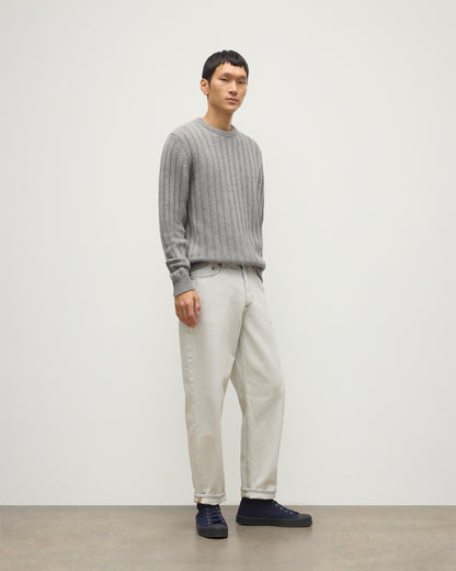 JOHNSTONS OF ELGIN MENS PEEL CREW SWEATER GREY 100% CASHMERE OVER A WHITE T-SHIRT WITH WHITE JEANS AND BLACK LOAFERS KAC05751HA0400