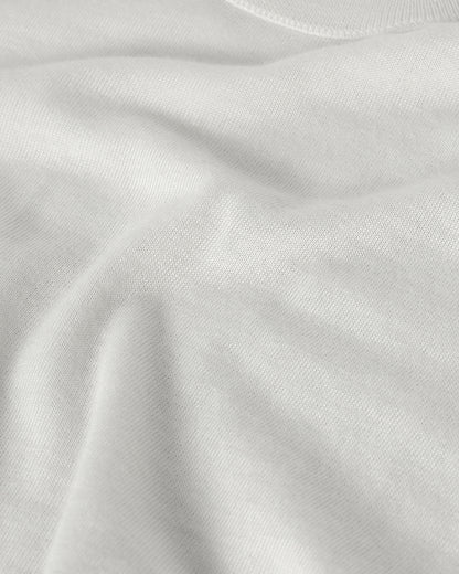 Johnstons of Elgin AW25 Men's Knitwear White Superfine Cashmere V Neck Jumper  against a white backdrop  KAI05242HA0327