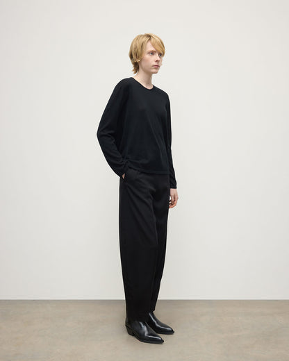 Model wearing Johnstons of Elgin AW25 Women's Knitwear Black Superfine Cashmere Black Jumper Side View KAI05318SA7146