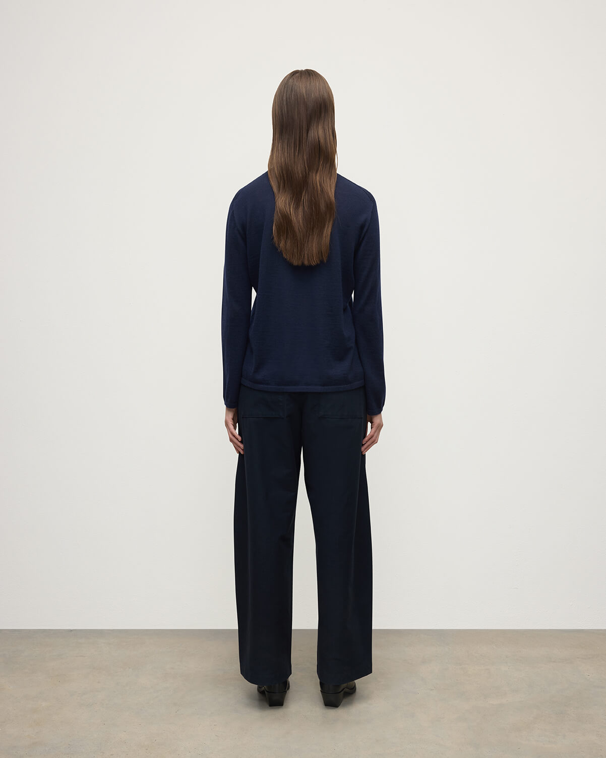 Model wears Johnstons of Elgin AW25 Women's Knitwear Navy Superfine Cashmere Jumper  KAI05318SD7600