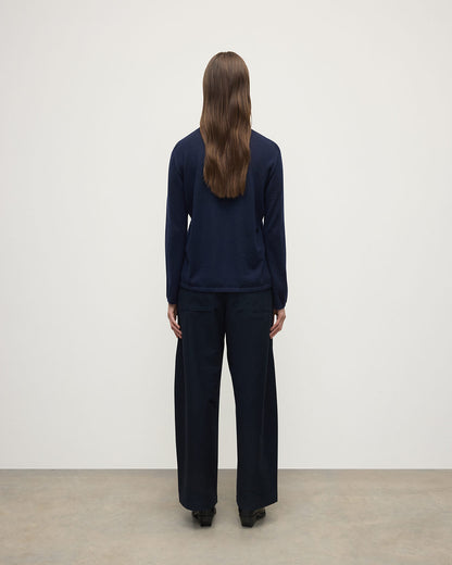 Model wears Johnstons of Elgin AW25 Women's Knitwear Navy Superfine Cashmere Jumper  KAI05318SD7600