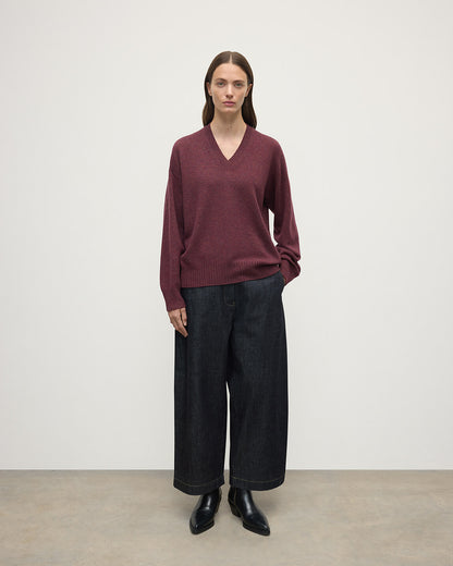 Model wearing Johnstons of Elgin AW25 Women's Knitwear Damson Gauzy Cashmere Purple V Neck Jumper Front View KAI05323HE7064