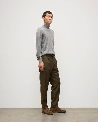 MODEL WEARS JOHNSTONS OF ELGIN MENS SUPERFINE FIN ROLL COLLAR GREY 100% SUPERFINE CASHMERE WITH OLIVE GREEN TROUSERS KAI05333HA4253