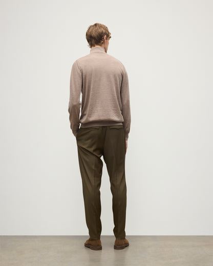 MODEL WEARING JOHNSTONS OF ELGIN MENS SUPERFINE FIN ROLL COLLAR GREY 100% SUPERFINE CASHMERE WITH OLIVE TROUSERS KAI05333HB0273