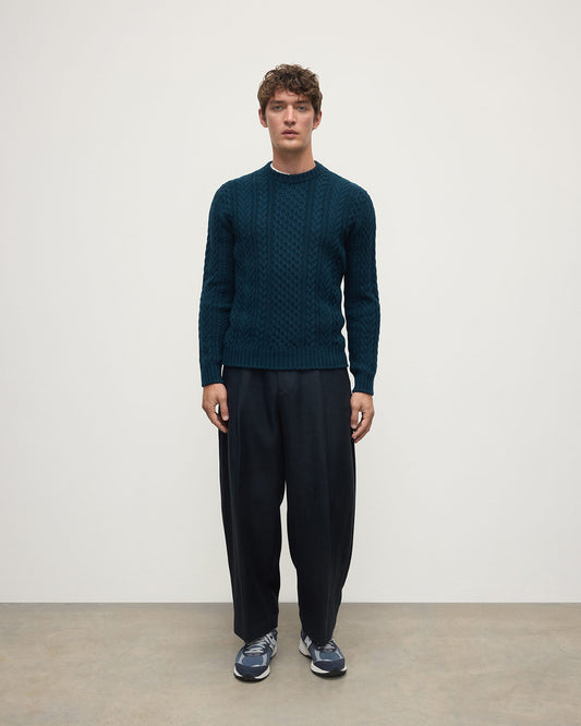 Model wearing Johnstons of Elgin AW25 Men's Knitwear Bottle Green Aran Cable Green Cashmere Jumper Front KAI05336SC7341