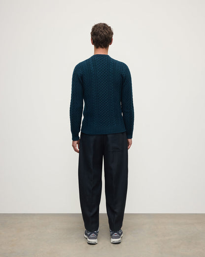 Model wearing Johnstons of Elgin AW25 Men's Knitwear Bottle Green Aran Cable Green Cashmere Jumper Back  KAI05336SC7341