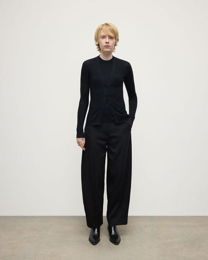 Model wears Johnstons of Elgin AW25 Women's Knitwear Black Superfine Cashmere Black Cardigan Front View KAI05372SA7146