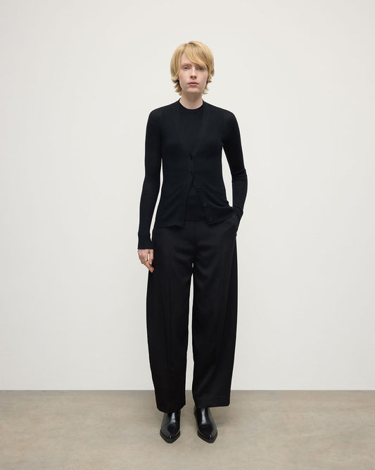Model wears Johnstons of Elgin AW25 Women's Knitwear Black Superfine Cashmere Black Cardigan Front View KAI05372SA7146