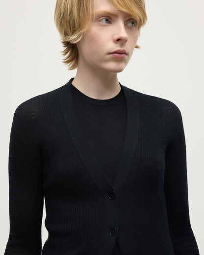 Model wears Johnstons of Elgin AW25 Women's Knitwear Black Superfine Cashmere Black Cardigan details KAI05372SA7146