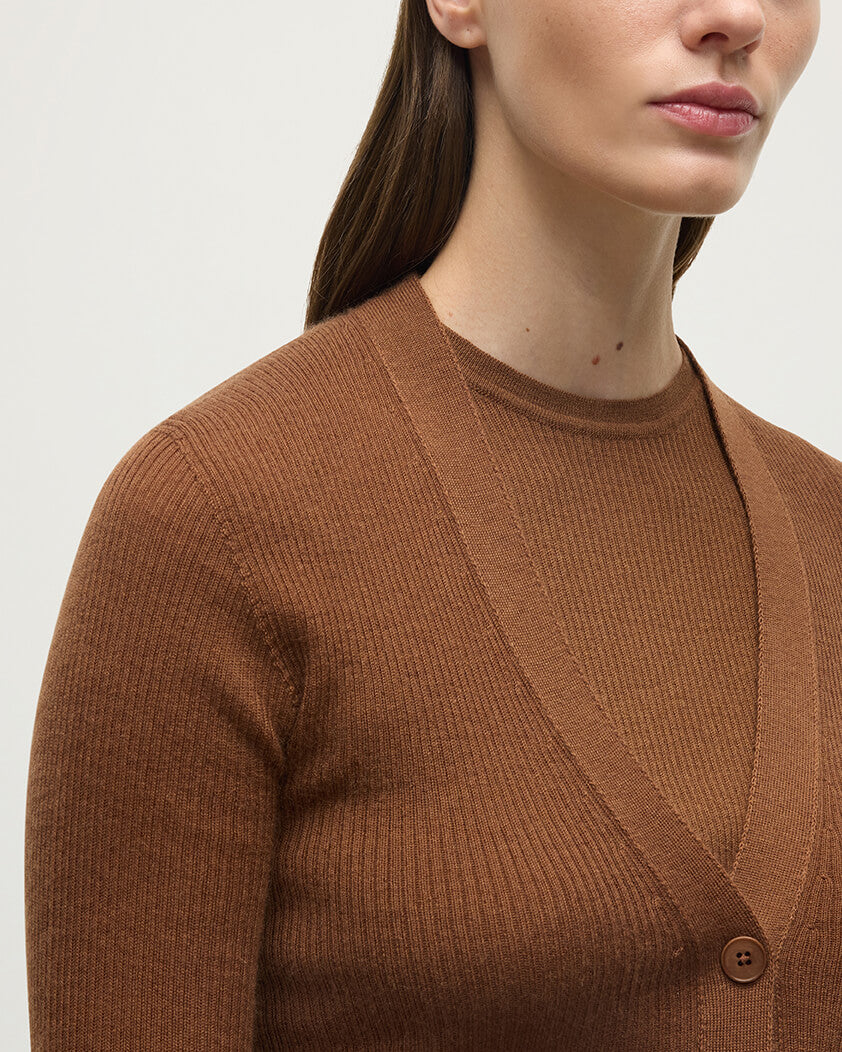Model wearing Johnstons of Elgin AW25 Women's Knitwear Dark Camel Superfine Cashmere Camel Cardigan neckline details KAI05372SB7300