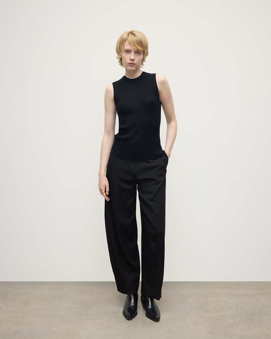 model wears Johnstons of Elgin AW25 Women's Knitwear Black Sleeveless Black Tank Top front view KAI05559SA7146