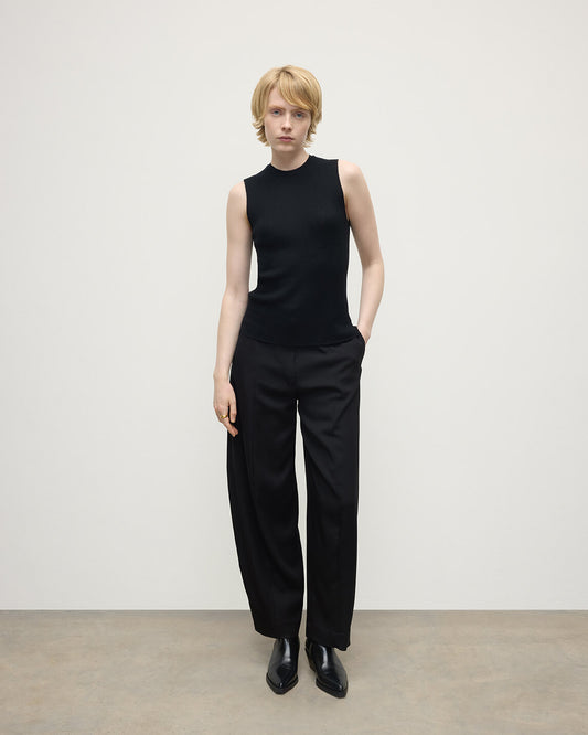 model wears Johnstons of Elgin AW25 Women's Knitwear Black Sleeveless Black Tank Top front view KAI05559SA7146