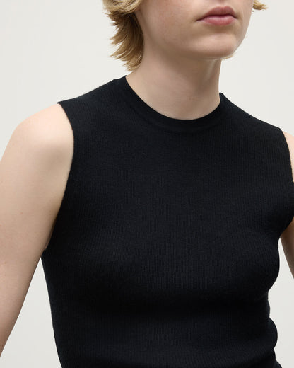 model wears Johnstons of Elgin AW25 Women's Knitwear Black Sleeveless Black Tank Top details KAI05559SA7146
