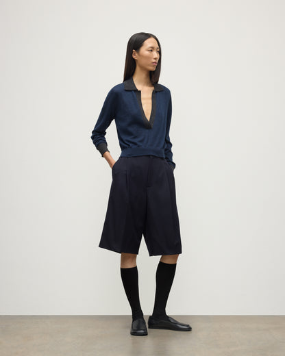MODEL WEARS JOHNSTONS OF ELGIN WOMENS DEE SHIRT NAVY & GREY 100% SUPERFINE CASHMERE WITH NAVY LONG SHIRTS< SOCKS AND LOAFERS KAI05713Q25962