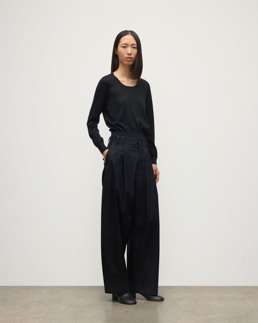 MODEL WEARING JOHNSTONS OF ELGIN WOMENS ELLA SCOOP SWEATER BLACK WITH BLACK TROUSERS KAI05723SA7146