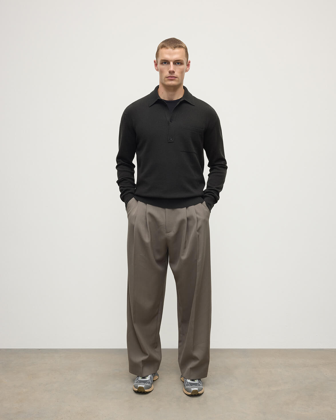 Johnstons of Elgin AW25 Men's Knitwear Iron Cashmere Long Sleeve Grey Poloshirt worn by model front view KAP05268Q25357