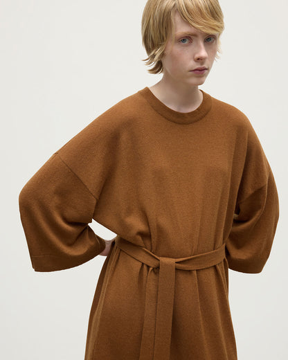 Model wears Johnstons of Elgin AW25 Women's Knitwear Dark Camel Tie-Waist Cashmere Camel Jumper Dress Details   KAP05490SB4620