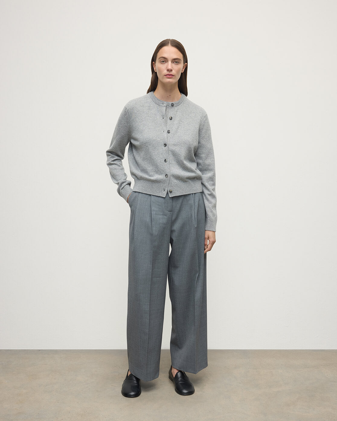 Model wears Johnstons of Elgin AW25 Women's Knitwear Light Grey Classic Cashmere Grey Cardigan Front KAP05573HA0308