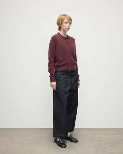 Model wears Johnstons of Elgin AW25 Women's Knitwear Damson Classic Cashmere Purple Cardigan Side KAP05573HE7064