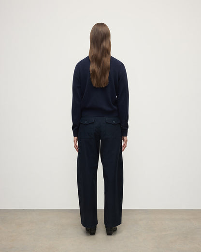 Model wears Johnstons of Elgin AW25 Women's Knitwear Dark Navy Classic Cashmere Navy Cardigan Back KAP05573SD7666