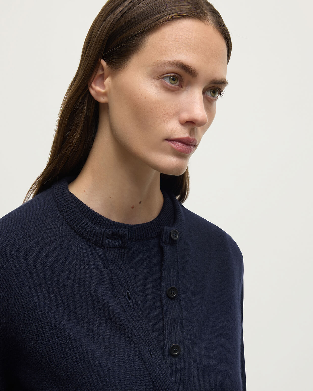 Model wears Johnstons of Elgin AW25 Women's Knitwear Dark Navy Classic Cashmere Navy Cardigan Close Up KAP05573SD7666
